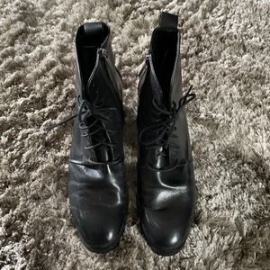 Gravitypope black lace up ankle boots with side zipper closure.
